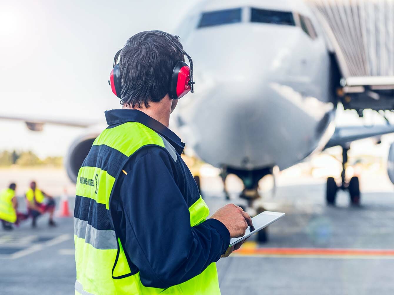 men operating an airplane on the grown