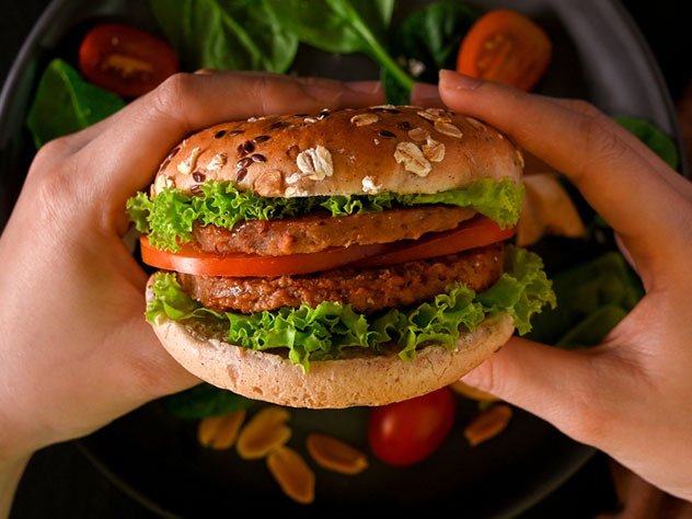 Eating plant-based burger